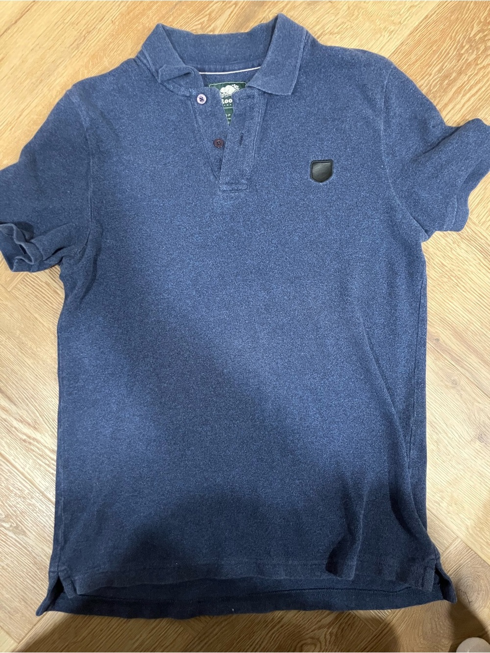 Roots Navy Polo with Black Shield Patch